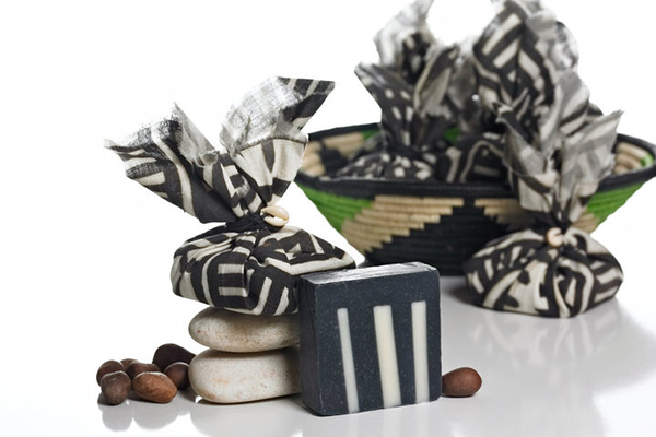 Thankfully, our packaging and photography got better over time. I'm especially proud of this handmade soap, wrapped in a beautiful handpainted mud cloth that I sourced directly from Mali, Africa, retailed in handmade baskets that I sourced directly from Uganda. 