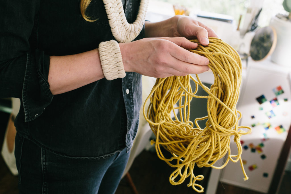 Lucky Break Meet the Maker featuring Zelma rose as she holds some hand dyed yarn.